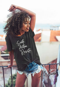 LSC Swag Female Model wearing Siente Actúa Resiste recycled t-shirt in Black
